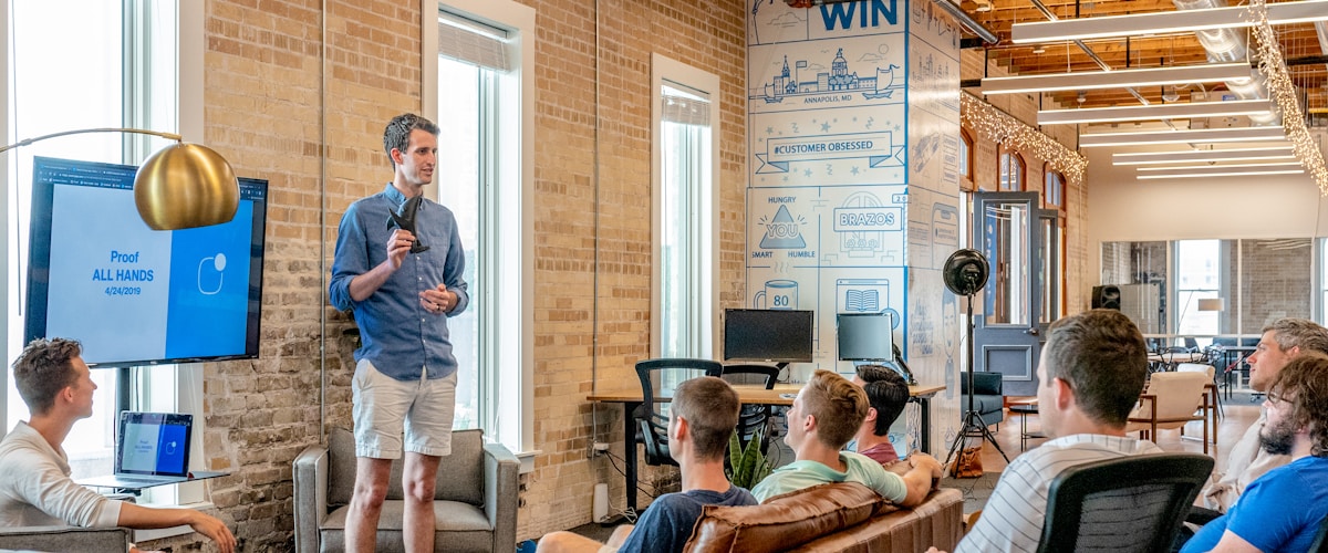 Small business owner working on laptop at their shop